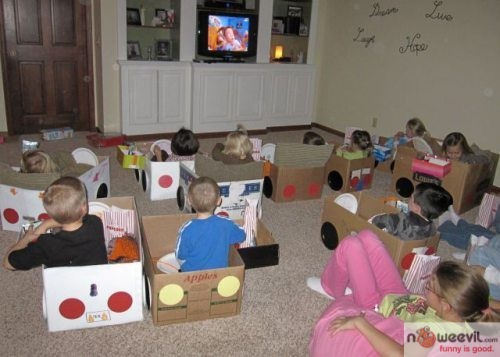 kids in boxes watching tv