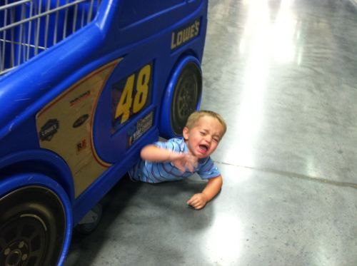 kid under cart